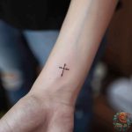 Unlocking the Meaning: The Intriguing World of Cross on Wrist Tattoos ...